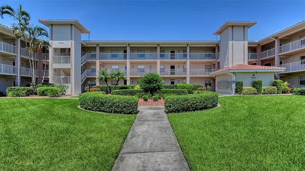 a front view of a building with garden