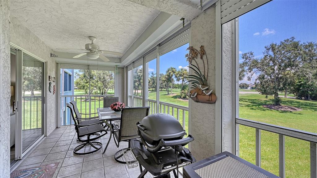 6505 Stone River Road, Unit 209 Bradenton, FL 34203 - Photo 16 of 47 a view of a workspace with furniture and garden