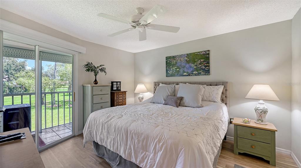 6505 Stone River Road, Unit 209 Bradenton, FL 34203 - Photo 18 of 47 a bed room with a bed and a tv