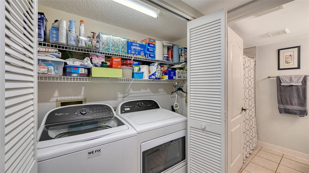 6505 Stone River Road, Unit 209 Bradenton, FL 34203 - Photo 23 of 47 a utility room with dryer and washer