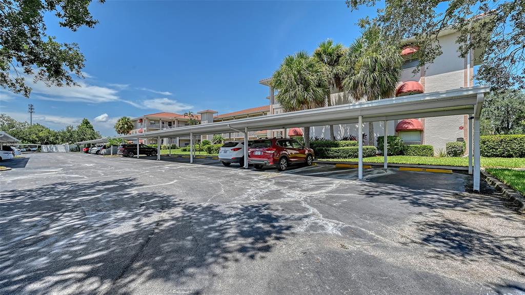 6505 Stone River Road, Unit 209 Bradenton, FL 34203 - Photo 24 of 47 a car parked in front of a house