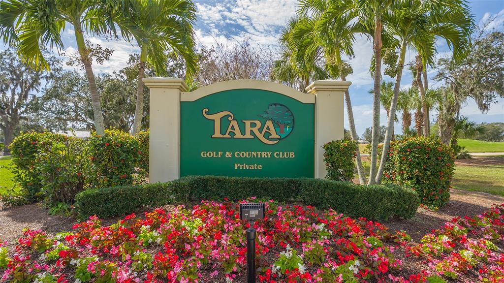 6505 Stone River Road, Unit 209 Bradenton, FL 34203 - Photo 25 of 47 a sign that is sitting in front of flowers