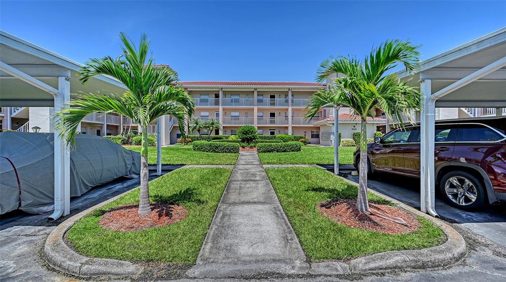 6505 Stone River Road, Unit 209 Bradenton, FL 34203 - Photo 3 of 47 a view of a house with a patio