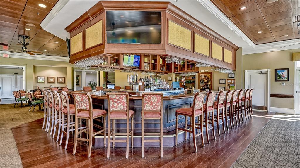 6505 Stone River Road, Unit 209 Bradenton, FL 34203 - Photo 35 of 47 a view of a building with dining table and chairs
