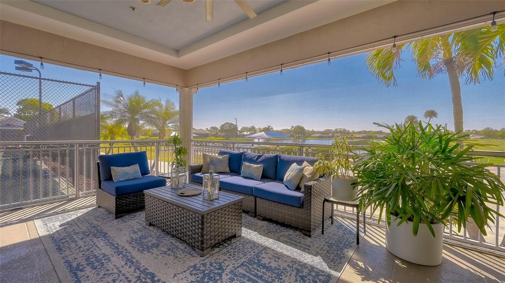 6505 Stone River Road, Unit 209 Bradenton, FL 34203 - Photo 36 of 47 a outdoor living space with furniture and garden view