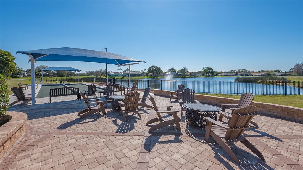 6505 Stone River Road, Unit 209 Bradenton, FL 34203 - Photo 40 of 47 an outdoor space with seating