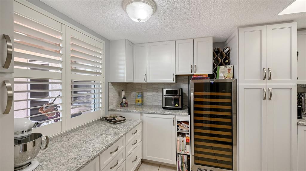 6505 Stone River Road, Unit 209 Bradenton, FL 34203 - Photo 7 of 47 a kitchen with stainless steel appliances a stove and a sink