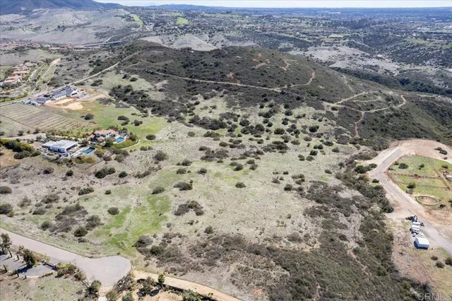 an aerial view of house with yard