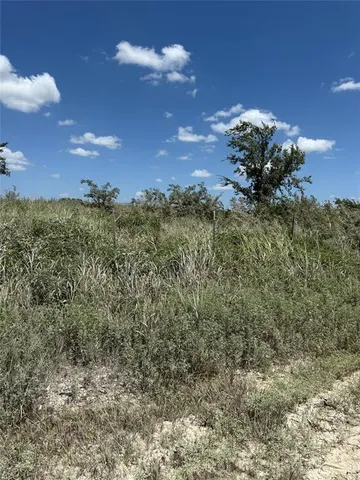 a view of a houses with a yard