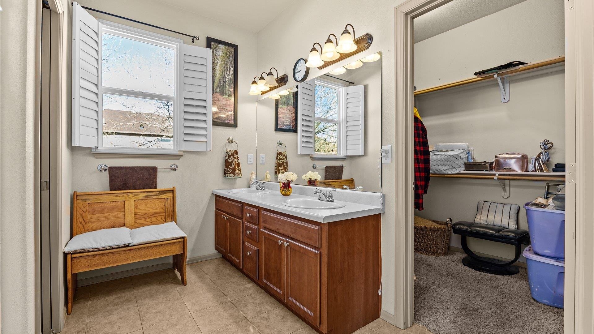 593 Sinatra Way Grand Junction, CO 81501 - Photo 14 of 23 a bathroom with a sink a mirror and a toilet