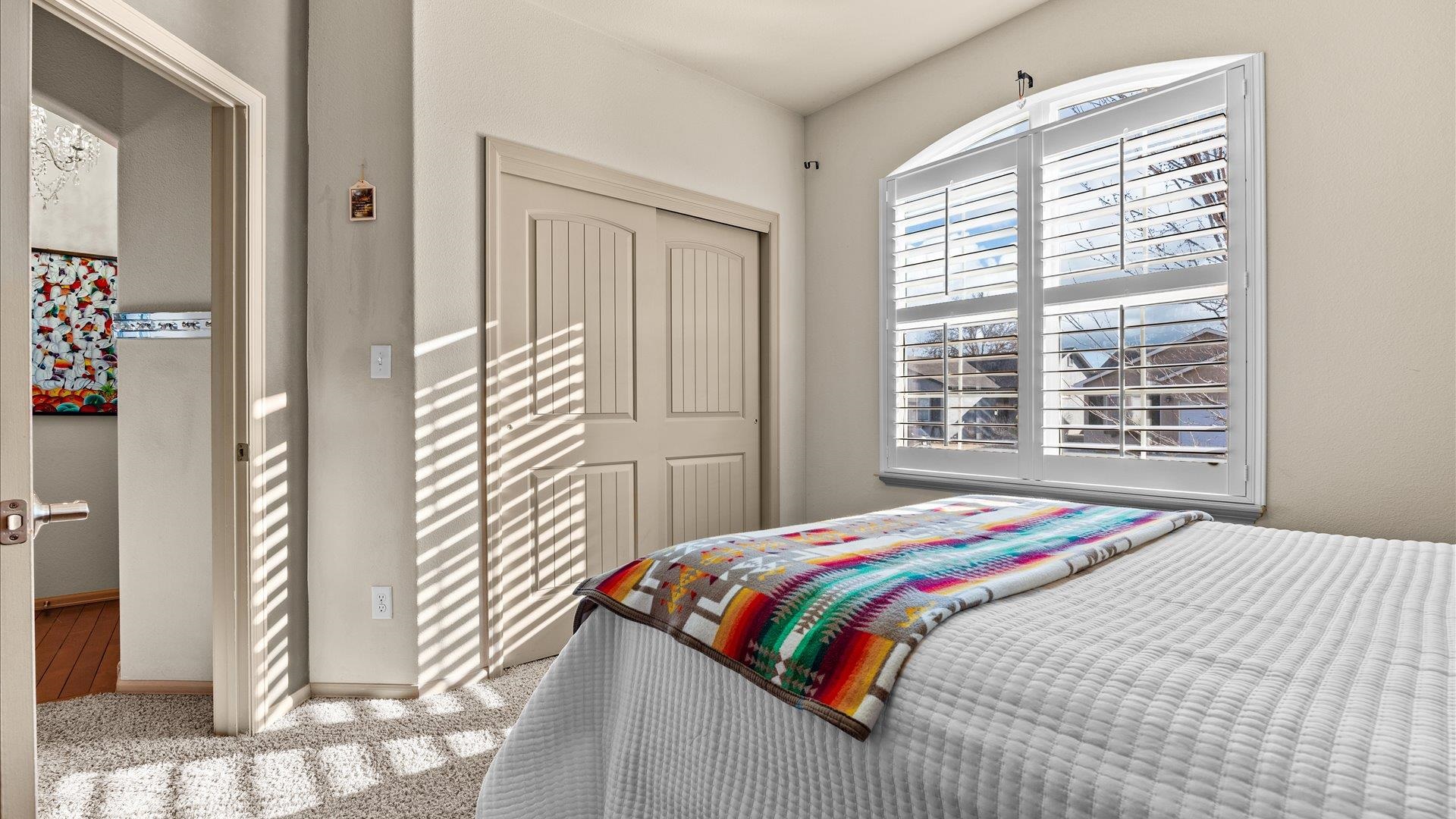 593 Sinatra Way Grand Junction, CO 81501 - Photo 17 of 23 a bedroom with a bed and a window
