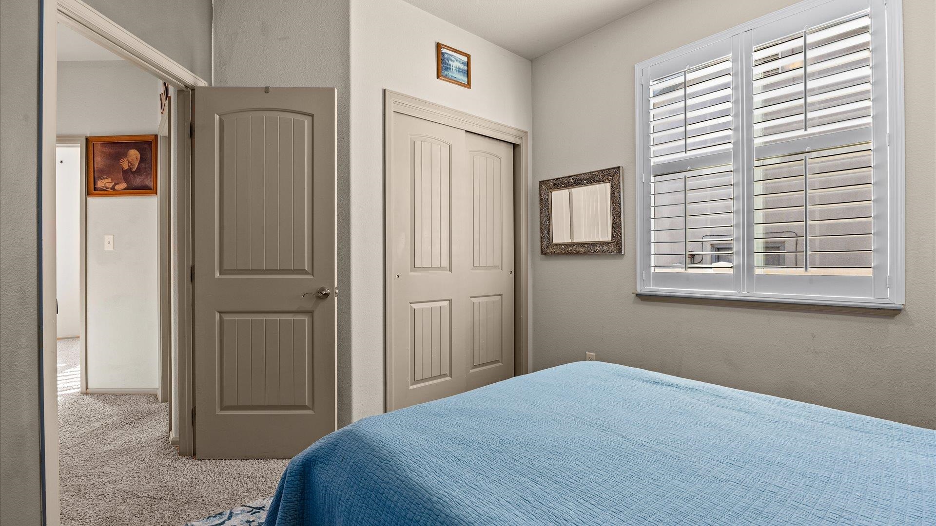 593 Sinatra Way Grand Junction, CO 81501 - Photo 19 of 23 a bedroom with a bed and a window