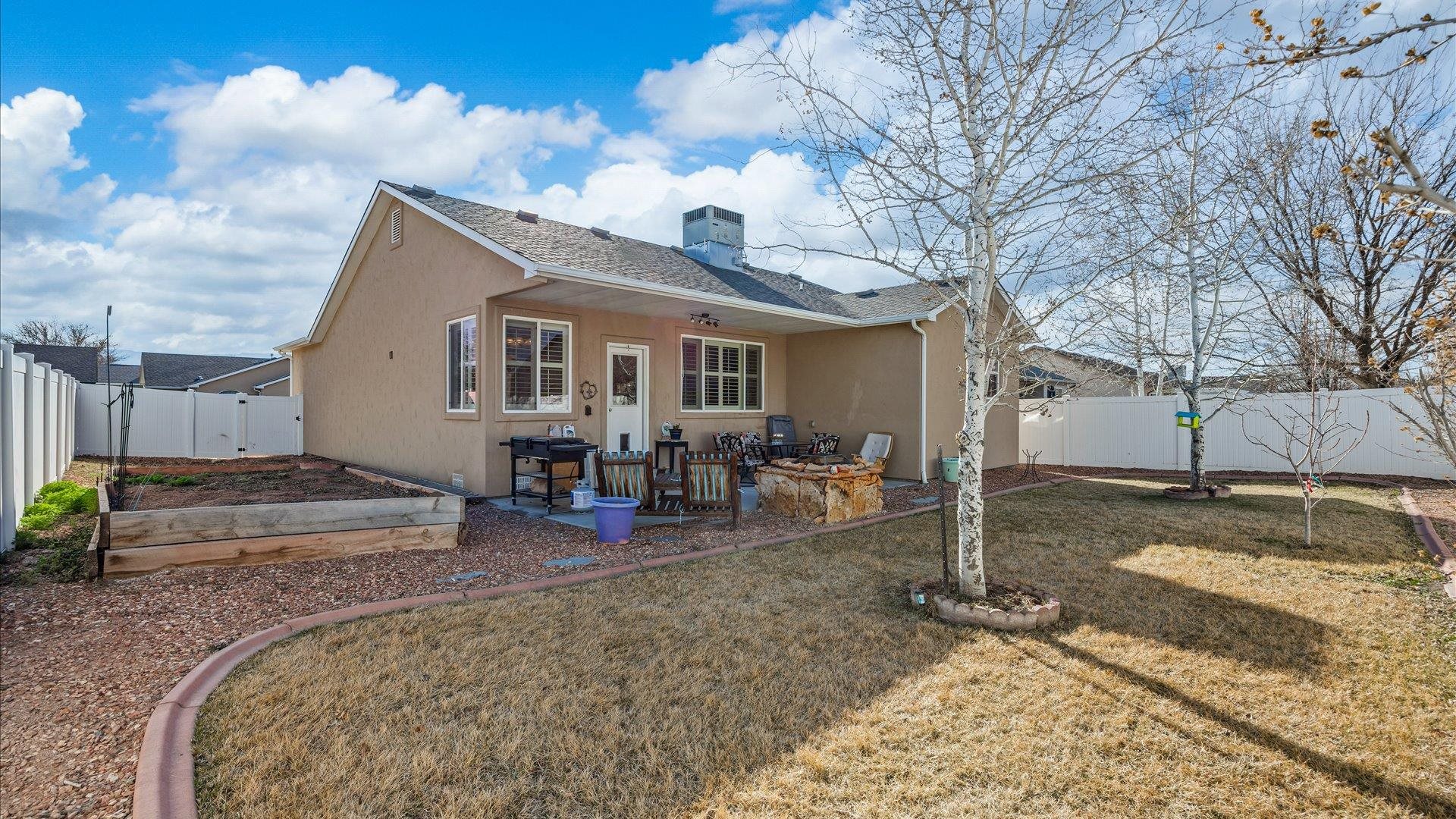 593 Sinatra Way Grand Junction, CO 81501 - Photo 22 of 23 a view of a house with a yard covered in snow