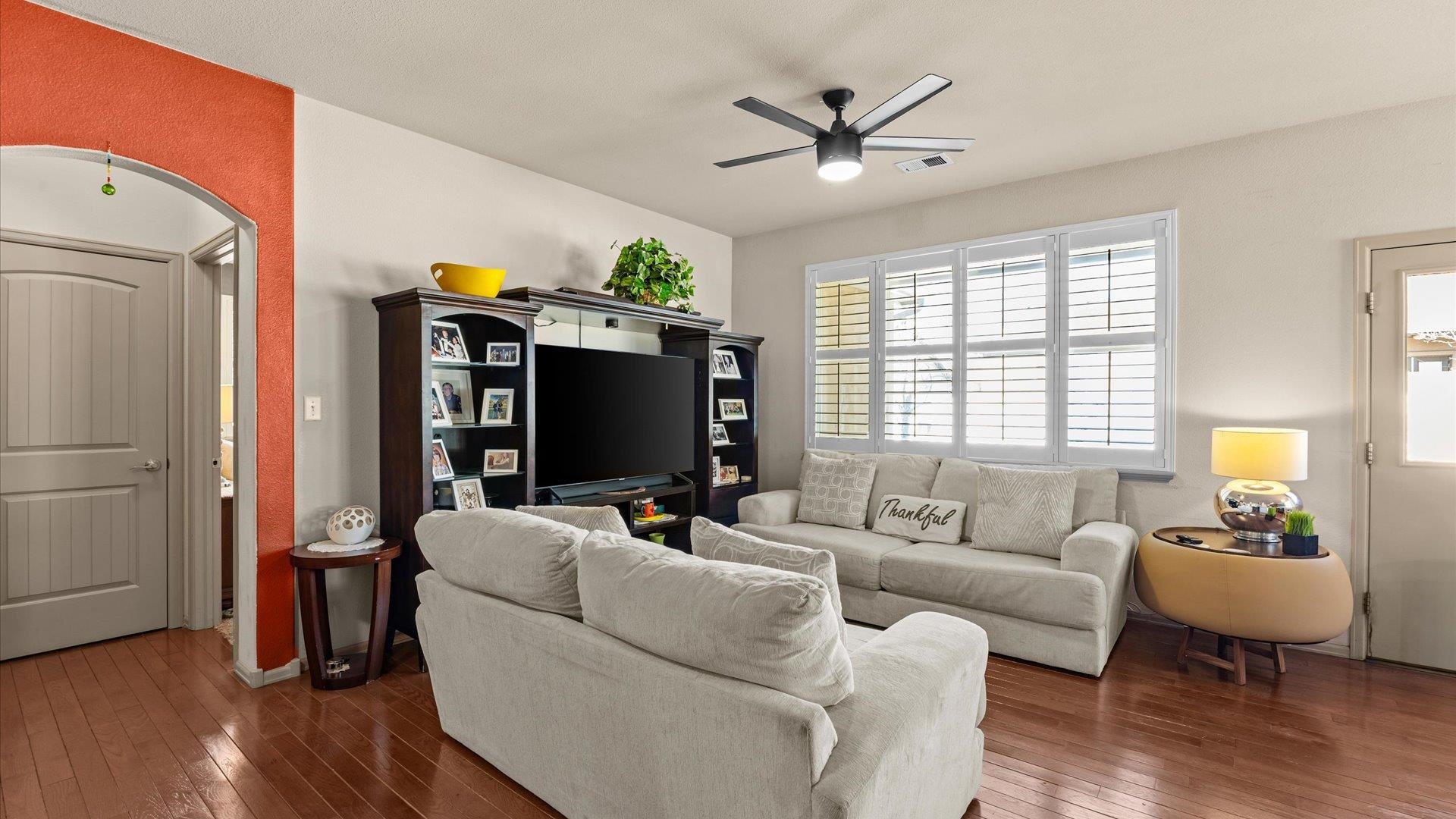 593 Sinatra Way Grand Junction, CO 81501 - Photo 6 of 23 a living room with furniture and a flat screen tv