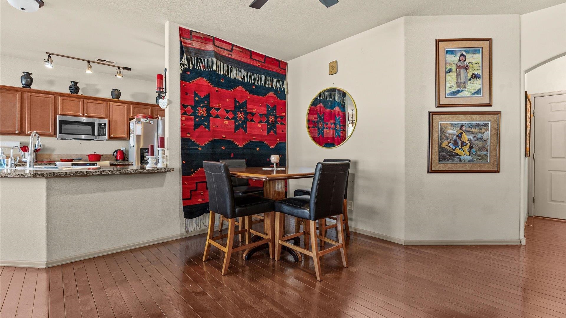 593 Sinatra Way Grand Junction, CO 81501 - Photo 10 of 23 a view of a dining room with furniture and wooden floor