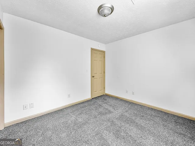 an empty room with a empty space and a window