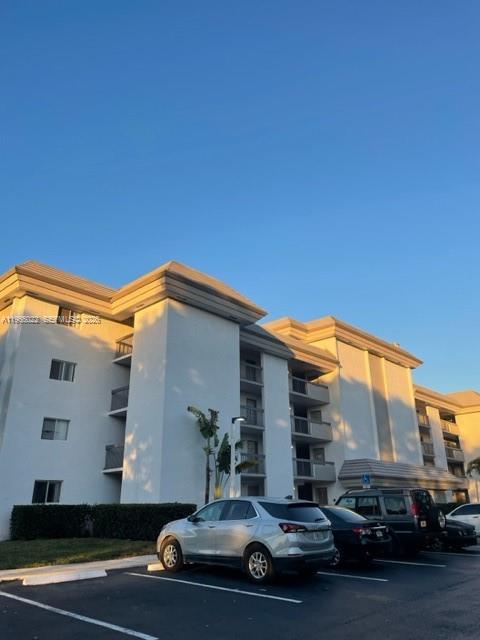 731 North Pine Island Road, Unit 306 Plantation, FL 33324 - Photo 1 of 13 a car parked in front of a house