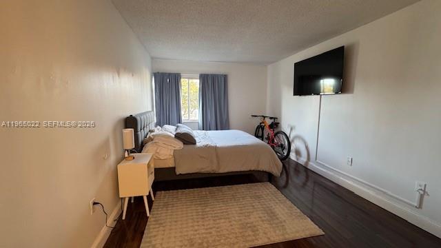 731 North Pine Island Road, Unit 306 Plantation, FL 33324 - Photo 11 of 13 a bed room with a bed tv and a window