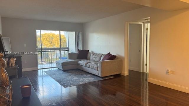 731 North Pine Island Road, Unit 306 Plantation, FL 33324 - Photo 12 of 13 a living room with furniture and a window