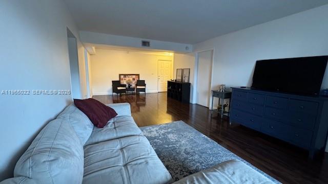 731 North Pine Island Road, Unit 306 Plantation, FL 33324 - Photo 4 of 13 a living room with furniture and a flat screen tv