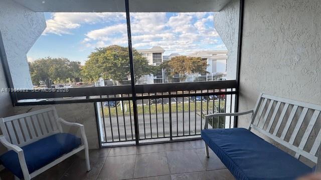 731 North Pine Island Road, Unit 306 Plantation, FL 33324 - Photo 5 of 13 a view of a chair in a balcony