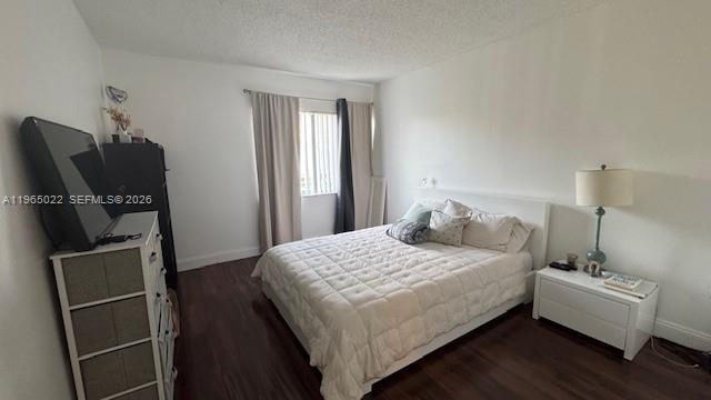 731 North Pine Island Road, Unit 306 Plantation, FL 33324 - Photo 9 of 13 a bedroom with a bed and a flat screen tv