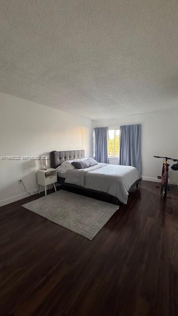 731 North Pine Island Road, Unit 306 Plantation, FL 33324 - Photo 10 of 13 a living room with furniture and a wooden floor