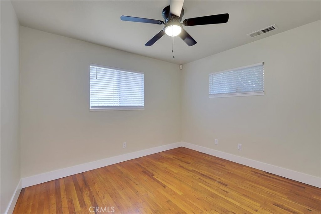 1291 East Chico, CA 95926 - Photo 19 of 29 an empty room with a window and a ceiling fan