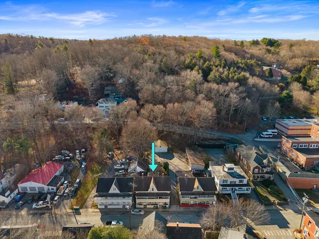 an aerial view of houses with yard