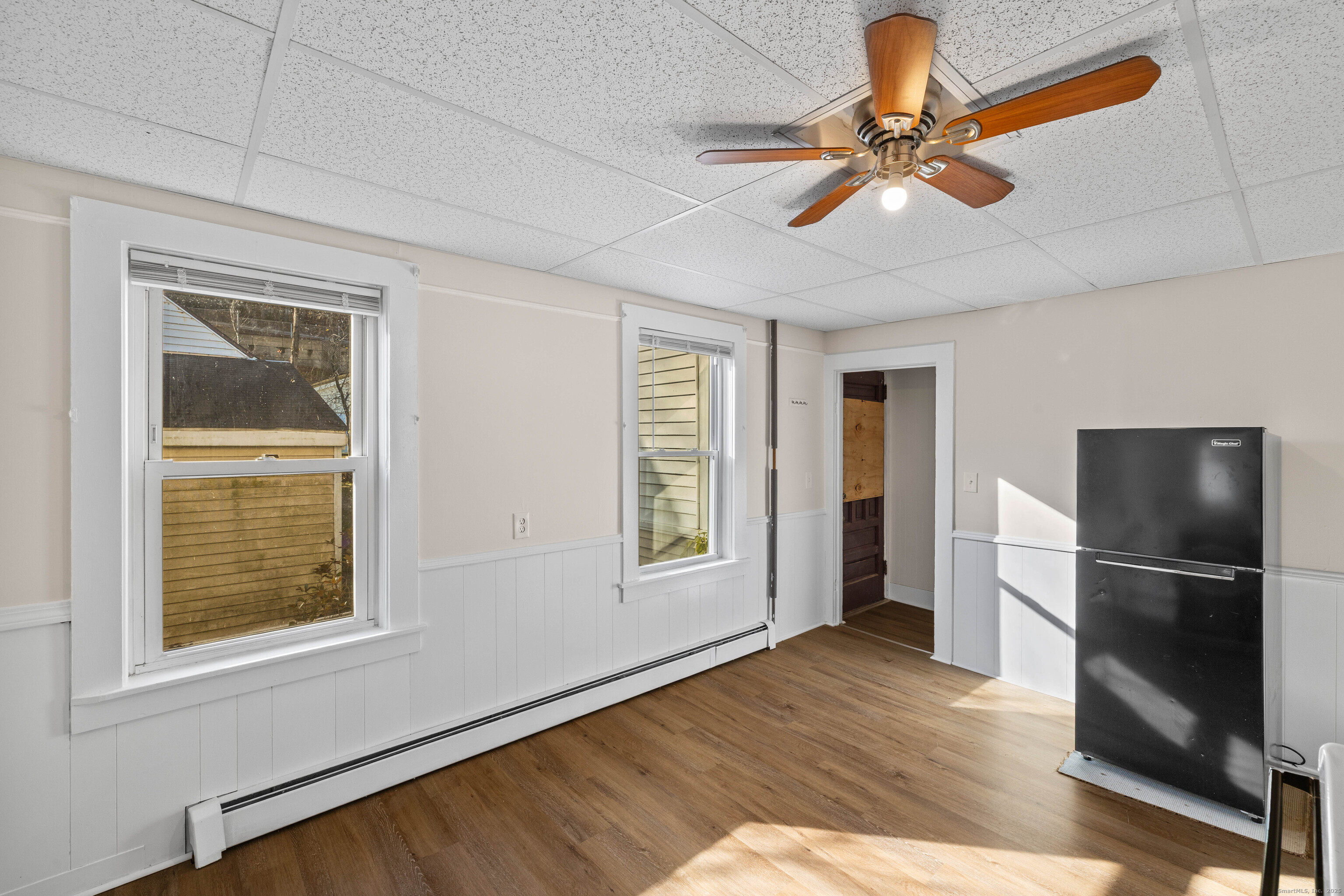 115 High Street Baltic, CT 06330 - Photo 24 of 37 a view of an empty room with a window and wooden floor