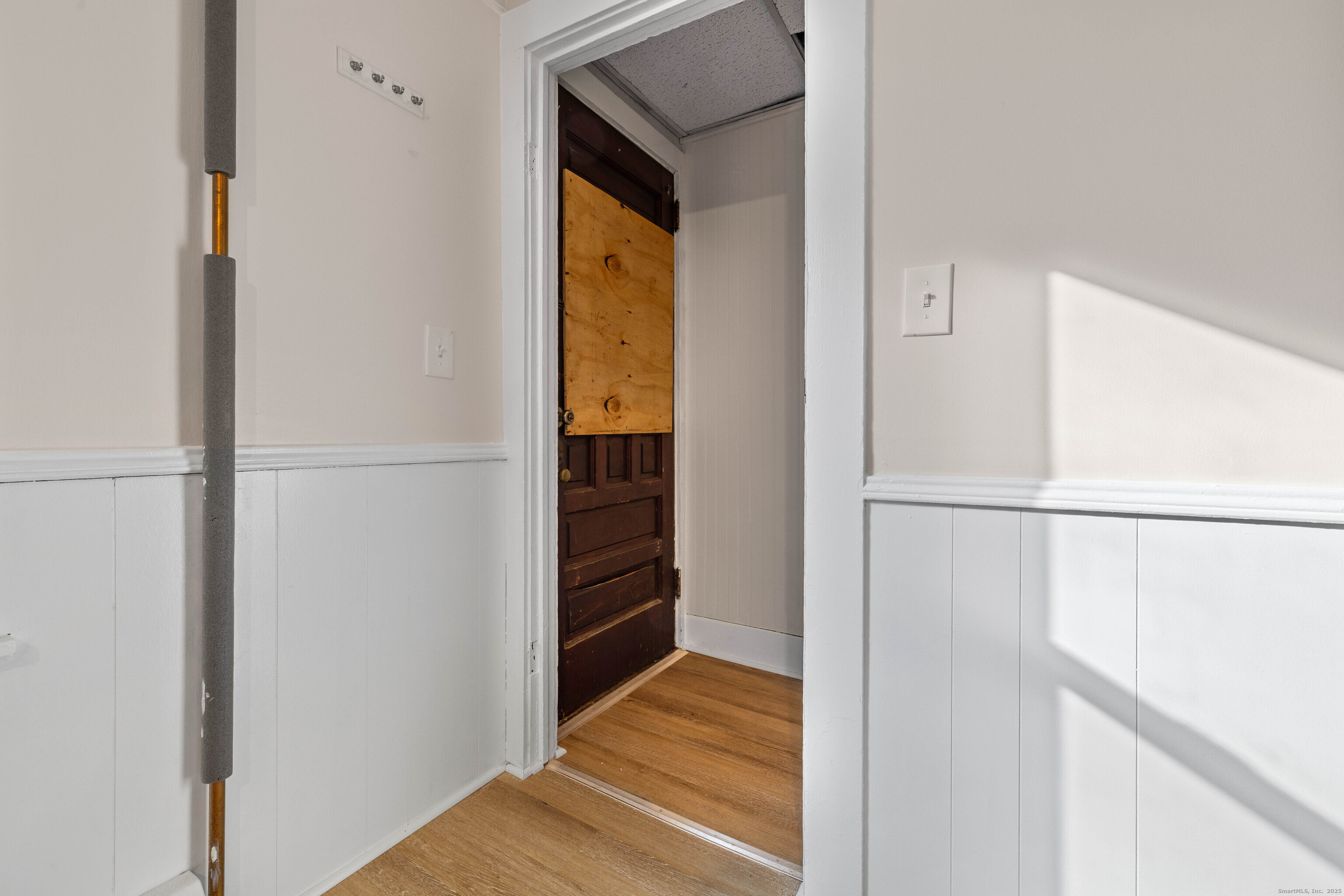 115 High Street Baltic, CT 06330 - Photo 26 of 37 a view of walk in closet with wooden floor