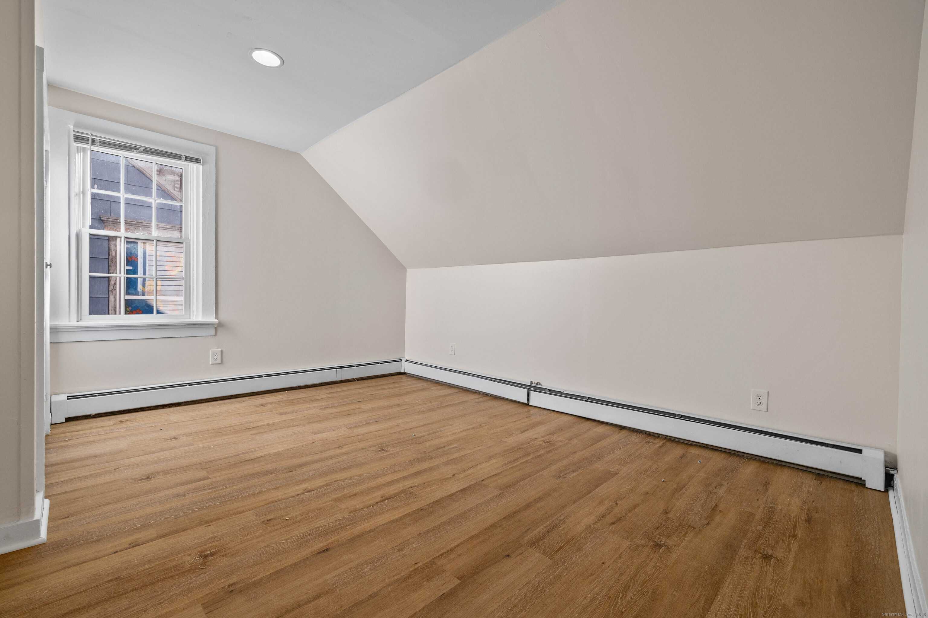 115 High Street Baltic, CT 06330 - Photo 29 of 37 wooden floor in an empty room with a window