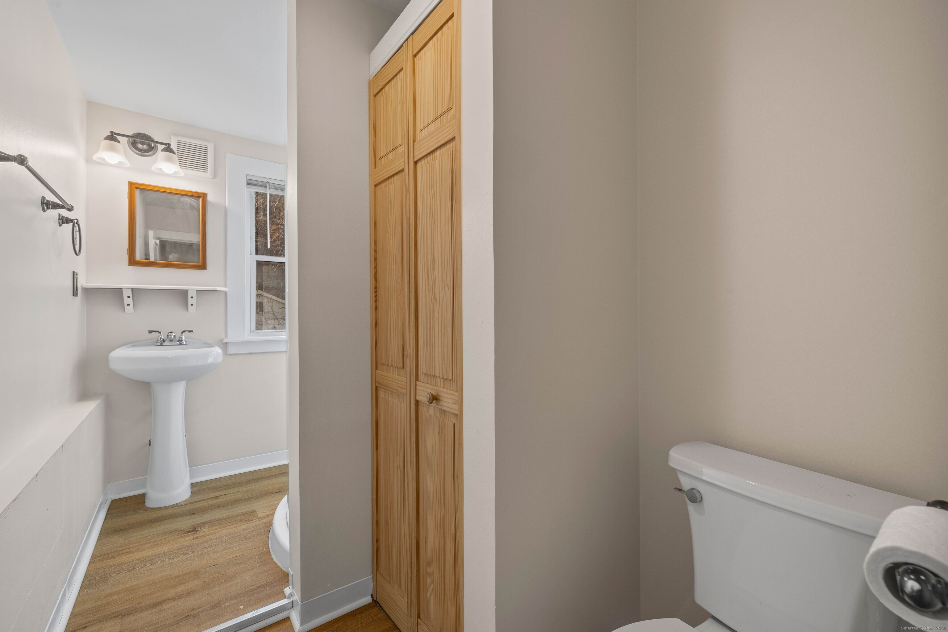 115 High Street Baltic, CT 06330 - Photo 32 of 37 a bathroom with a sink and a mirror