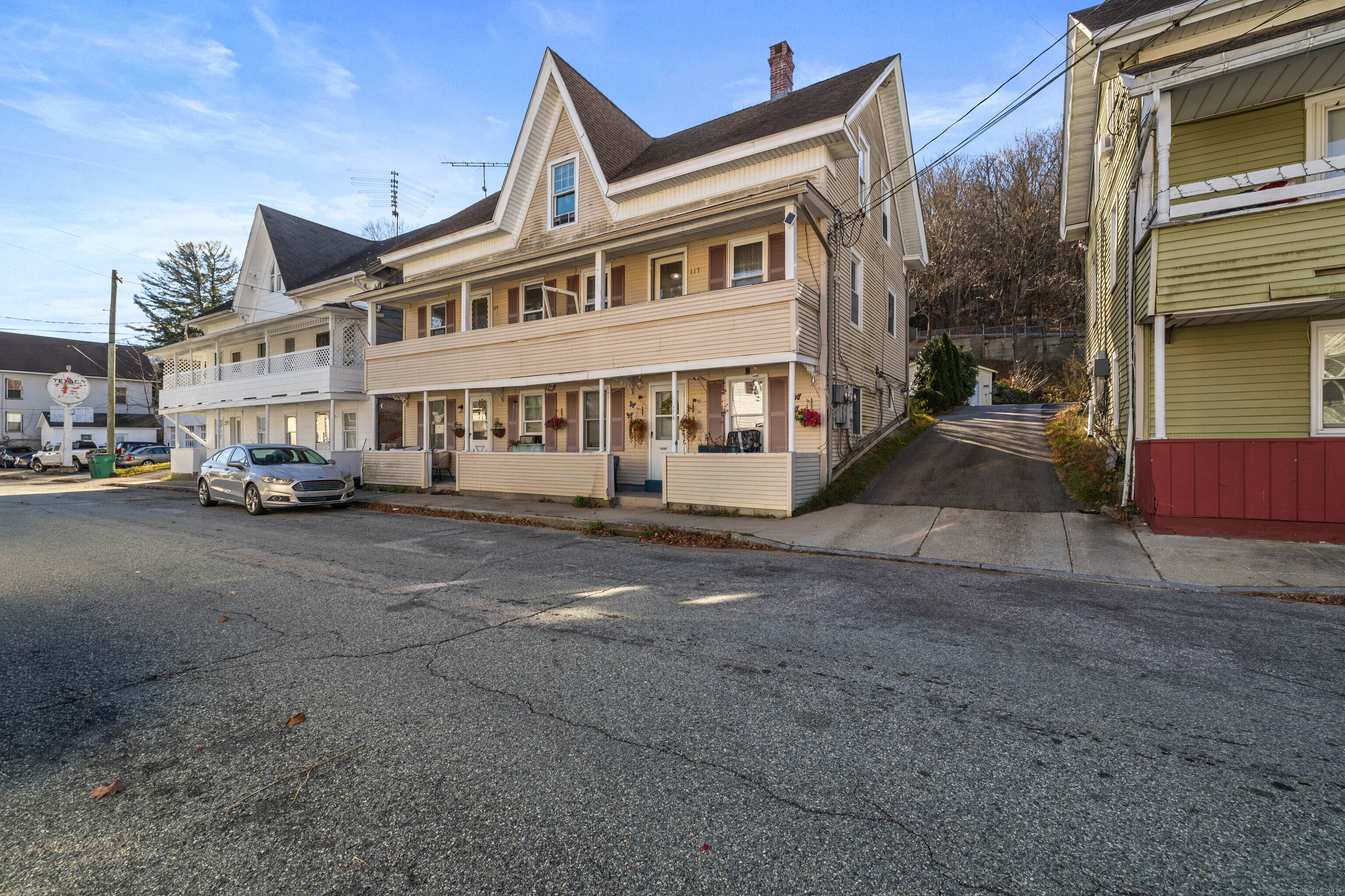 115 High Street Baltic, CT 06330 - Photo 4 of 37 a car parked in front of a building