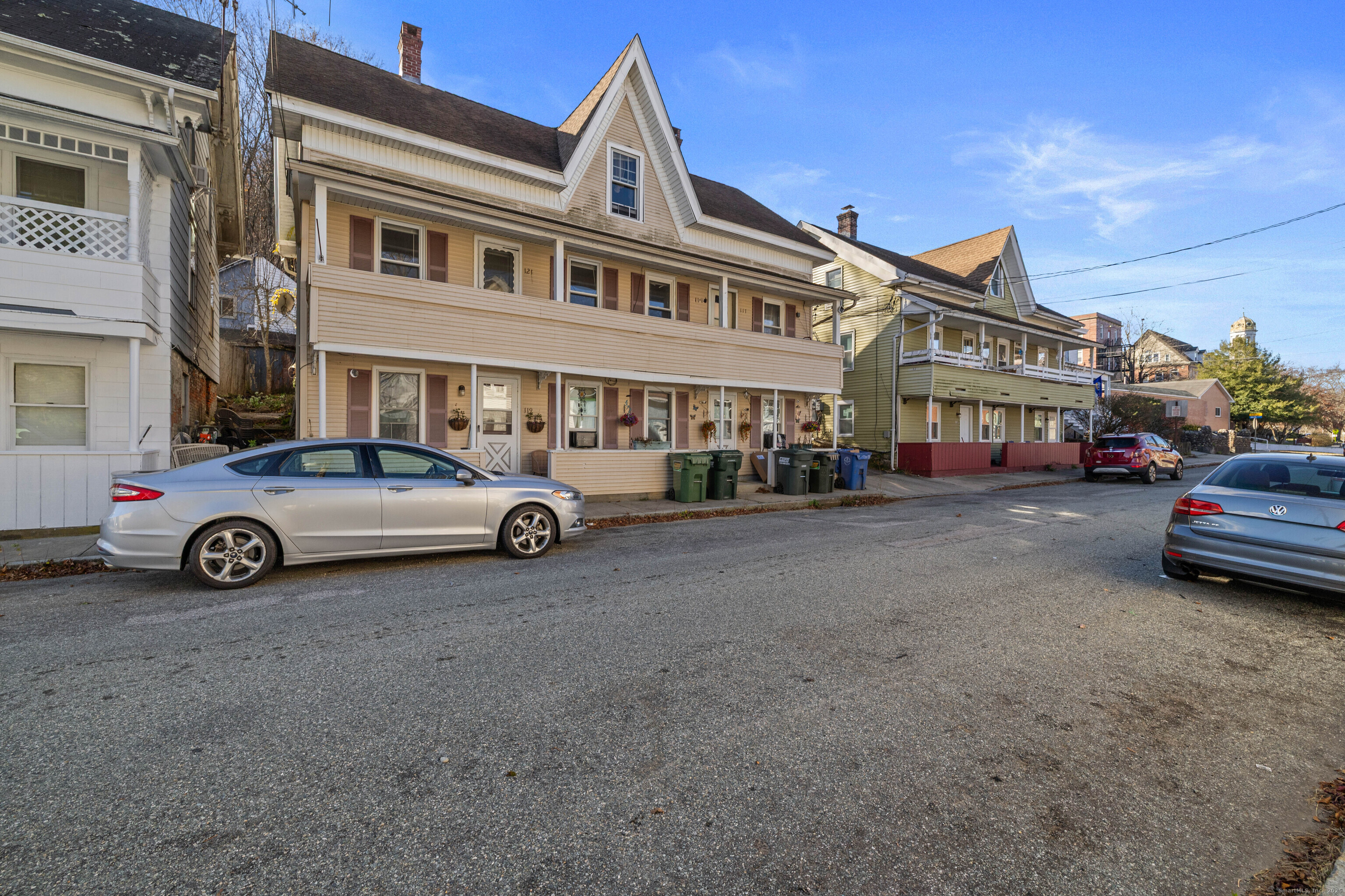 115 High Street Baltic, CT 06330 - Photo 5 of 37 a car parked in front of a white house