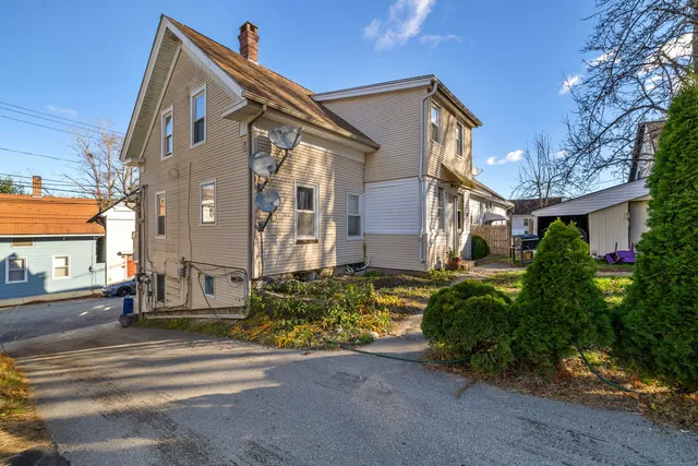 a view of a house with a yard