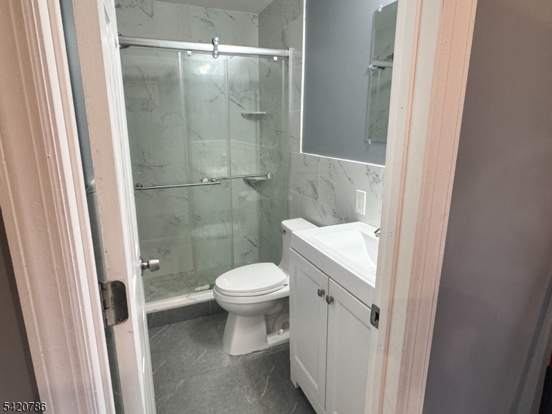 17 Home Street Somerset, NJ 08873 - Photo 11 of 20 a bathroom with a toilet and a shower