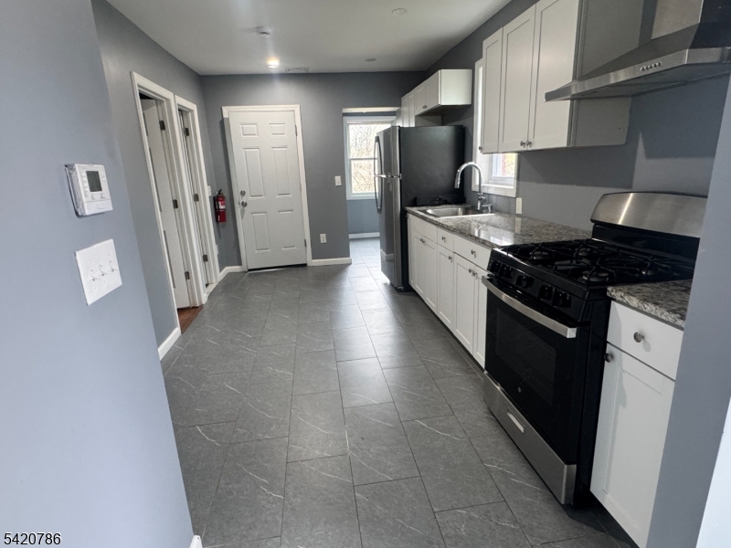 17 Home Street Somerset, NJ 08873 - Photo 15 of 20 a kitchen with stainless steel appliances granite countertop a refrigerator and a stove