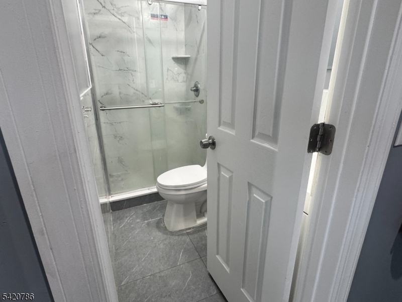 17 Home Street Somerset, NJ 08873 - Photo 19 of 20 a bathroom with a toilet and a shower
