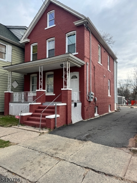 17 Home Street Somerset, NJ 08873 - Photo 3 of 20 a front view of a house with a garden