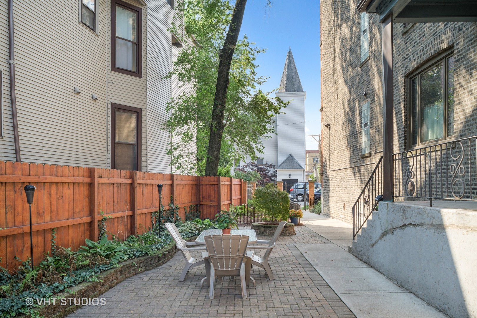 1530 West Edgewater Avenue, Unit 2R Chicago, IL 60660 - Photo 3 of 12 a view of a patio with couches table and chairs and potted plants