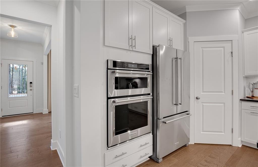 239 Rockledge Bend Southwest Powder Springs, GA 30127 - Photo 11 of 16 a kitchen with cabinets and stainless steel appliances