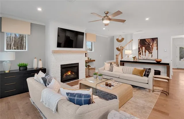 a living room with furniture fireplace and window