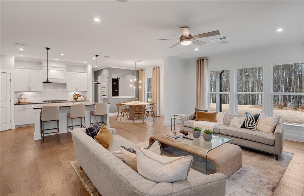 239 Rockledge Bend Southwest Powder Springs, GA 30127 - Photo 6 of 16 a living room with furniture kitchen and a table