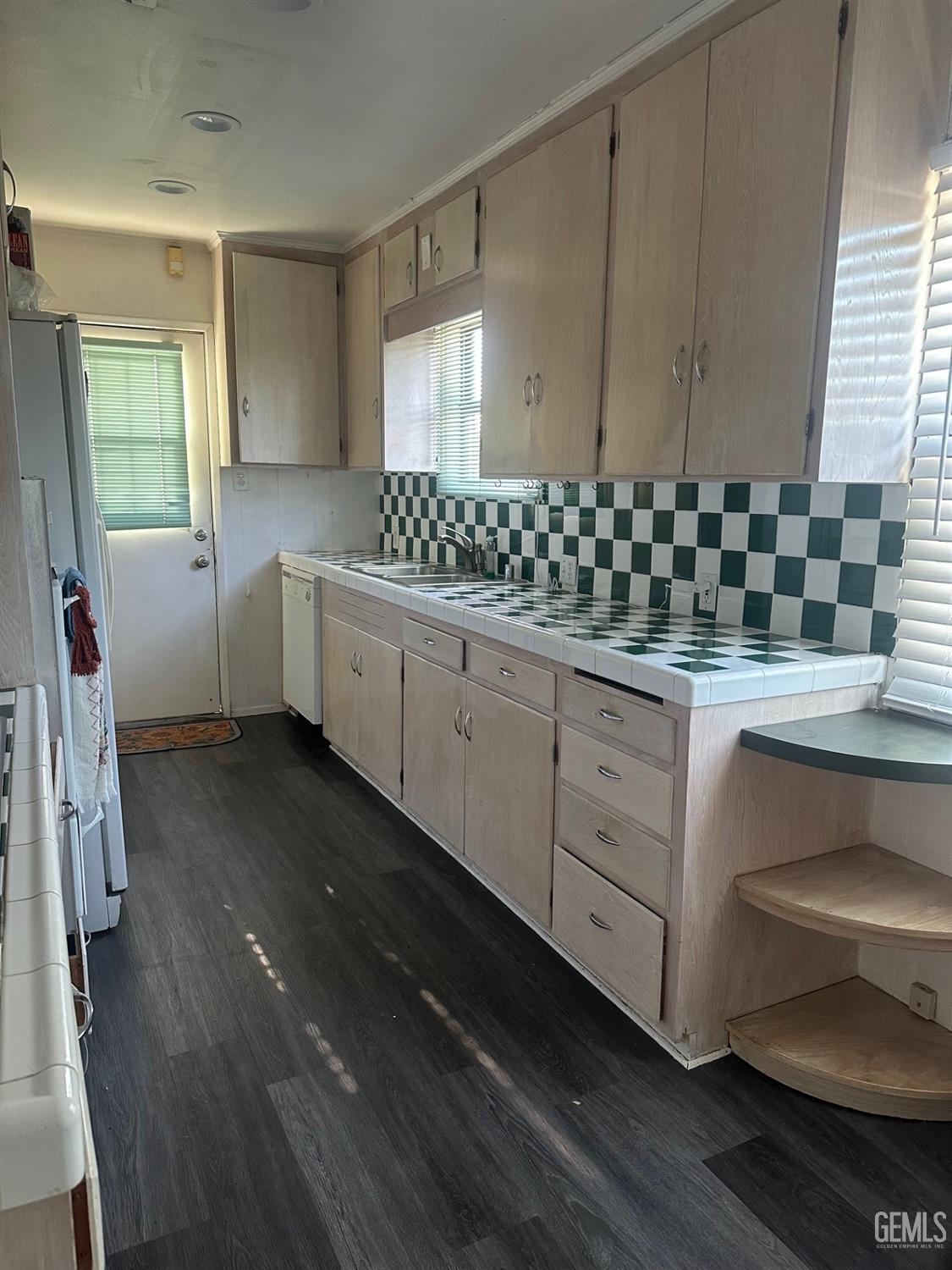 Undisclosed Address Lawndale, CA 90260 - Photo 2 of 7 a kitchen with granite countertop white cabinets and white appliances