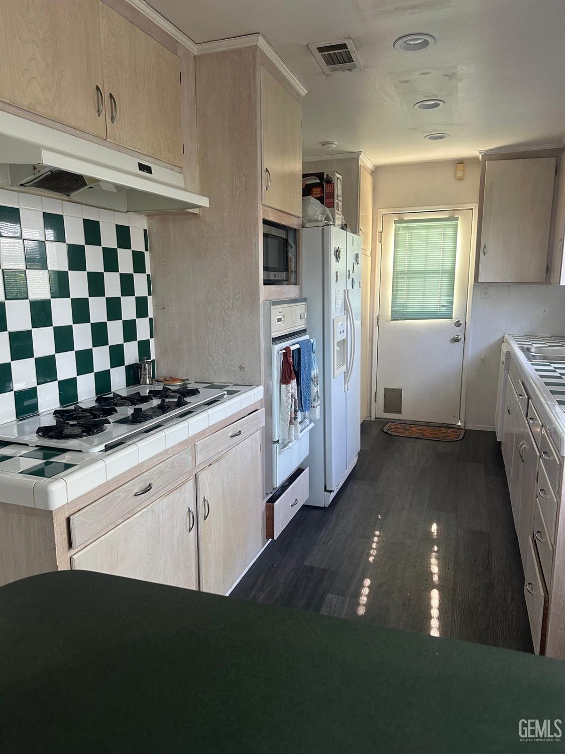 Undisclosed Address Lawndale, CA 90260 - Photo 3 of 7 a kitchen with a sink and refrigerator