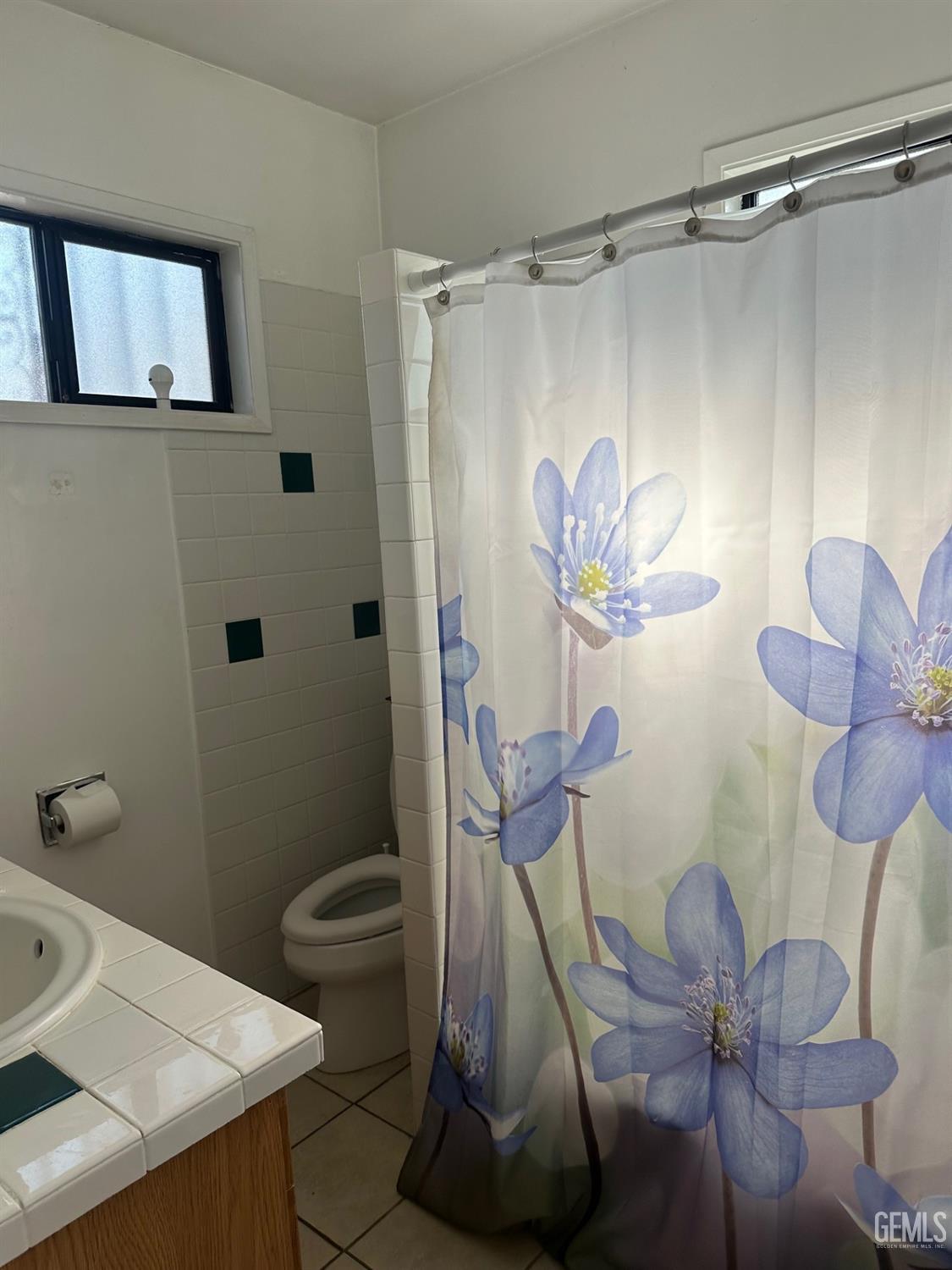 Undisclosed Address Lawndale, CA 90260 - Photo 5 of 7 a bathroom with a sink a toilet and shower