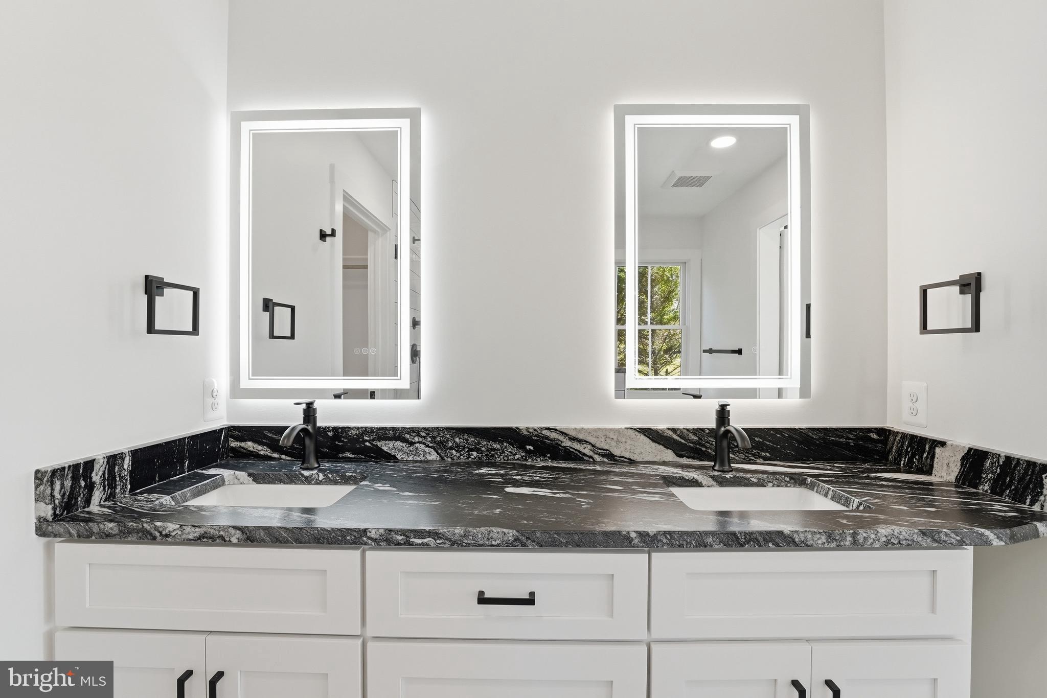 1548 James City Road Reva, VA 22735 - Photo 26 of 48 a bathroom with a granite countertop sink and a mirror