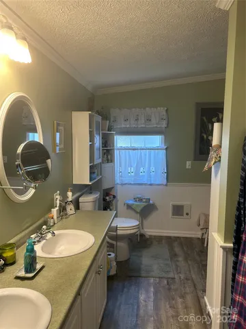 a bathroom with a glass shower door