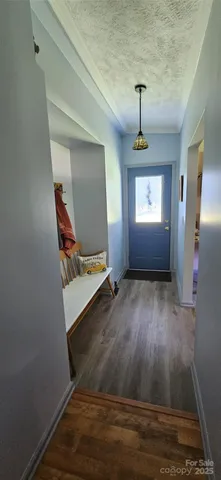 a kitchen with a refrigerator and cabinets